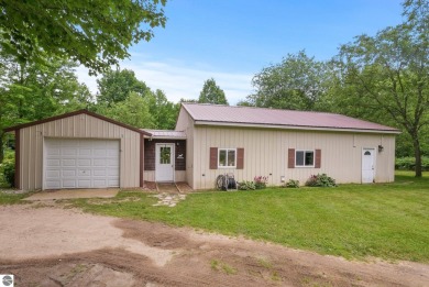 Nestled in an idyllic setting, this Barndominium home boasts on Lakes of the North Deer Run Golf Course in Michigan - for sale on GolfHomes.com, golf home, golf lot