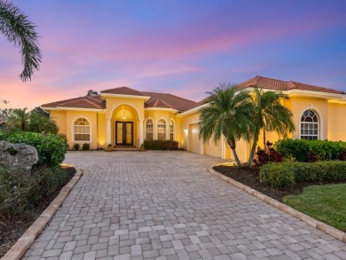 This lakefront custom home sits on an oversized cul-de-sac lot on Boca Royale Golf and Country Club in Florida - for sale on GolfHomes.com, golf home, golf lot