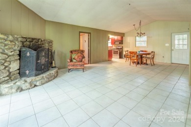 A charming cottage with easy access and privacy.  This home on Wolf Laurel Country Club in North Carolina - for sale on GolfHomes.com, golf home, golf lot