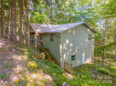 A charming cottage with easy access and privacy.  This home on Wolf Laurel Country Club in North Carolina - for sale on GolfHomes.com, golf home, golf lot