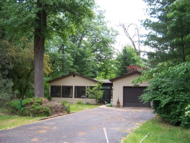 Year round home on nearly one acre wooded setting.  House is on Burning Oak Country Club in Michigan - for sale on GolfHomes.com, golf home, golf lot