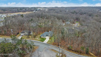 Welcome home to this inviting 3-bedroom, 2-bath split-bedroom on Druid Hills Golf Club in Tennessee - for sale on GolfHomes.com, golf home, golf lot