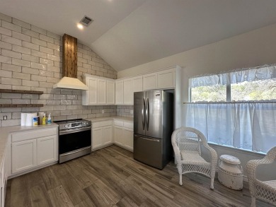 Want a COOL LAKE VIEW? Look at this! The home is so cute, one on Slick Rock Golf Course - Horseshoe Bay in Texas - for sale on GolfHomes.com, golf home, golf lot