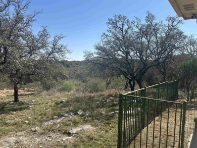 Want a COOL LAKE VIEW? Look at this! The home is so cute, one on Slick Rock Golf Course - Horseshoe Bay in Texas - for sale on GolfHomes.com, golf home, golf lot