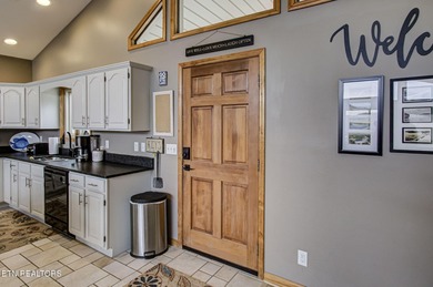 Enjoy effortless lake living in this fully furnished, turnkey on The Greens at Deerfield in Tennessee - for sale on GolfHomes.com, golf home, golf lot