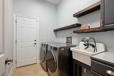 Experience luxury living in this exquisite custom-built Hidden on The Club At Hidden Creek in Florida - for sale on GolfHomes.com, golf home, golf lot