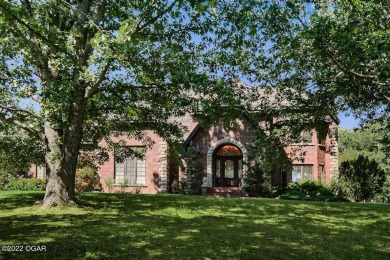 This must see Ozark property includes a well maintained brick on Elk River Country Club in Missouri - for sale on GolfHomes.com, golf home, golf lot