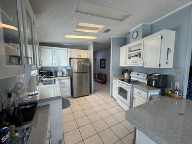 Welcome to your perfect Florida oasis with panoramic golf course on Schalamar Creek Golf and Country Club in Florida - for sale on GolfHomes.com, golf home, golf lot