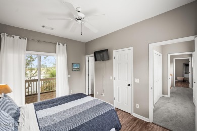Located on the serene salt marsh with sweeping deep-water views on Ocean Creek Golf Course in South Carolina - for sale on GolfHomes.com, golf home, golf lot