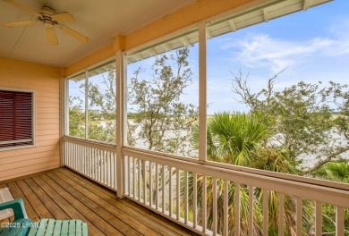 Located on the serene salt marsh with sweeping deep-water views on Ocean Creek Golf Course in South Carolina - for sale on GolfHomes.com, golf home, golf lot