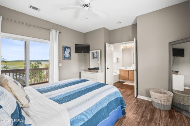 Located on the serene salt marsh with sweeping deep-water views on Ocean Creek Golf Course in South Carolina - for sale on GolfHomes.com, golf home, golf lot