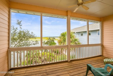 Located on the serene salt marsh with sweeping deep-water views on Ocean Creek Golf Course in South Carolina - for sale on GolfHomes.com, golf home, golf lot
