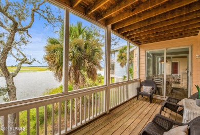 Located on the serene salt marsh with sweeping deep-water views on Ocean Creek Golf Course in South Carolina - for sale on GolfHomes.com, golf home, golf lot