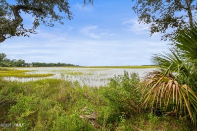 Located on the serene salt marsh with sweeping deep-water views on Ocean Creek Golf Course in South Carolina - for sale on GolfHomes.com, golf home, golf lot