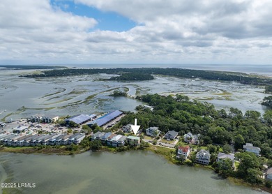 Easy to show!Located on the serene salt marsh with sweeping on Ocean Creek Golf Course in South Carolina - for sale on GolfHomes.com, golf home, golf lot