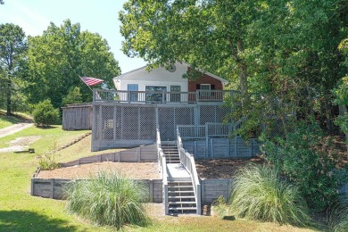 Live the lake life! This peaceful lakefront oasis is calling for sale on GolfHomes.com