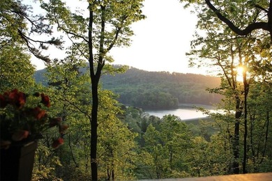 Experience tranquility and breathtaking views at this on Big Canoe Golf Club - Cherokee in Georgia - for sale on GolfHomes.com, golf home, golf lot