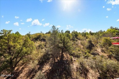 Built in 2018, this custom home is tucked away in the serene on Capital Canyon Club in Arizona - for sale on GolfHomes.com, golf home, golf lot