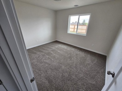 Brand new construction. Located in Hidden Bridge Ranch across on Hidden Bridge Golf Club in Wyoming - for sale on GolfHomes.com, golf home, golf lot