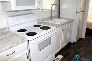 This super fun 1BR/1BA tiny home packs a lot of punch! This home on Lily Lake Golf and RV Resort in Florida - for sale on GolfHomes.com, golf home, golf lot