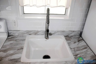 This super fun 1BR/1BA tiny home packs a lot of punch! This home on Lily Lake Golf and RV Resort in Florida - for sale on GolfHomes.com, golf home, golf lot