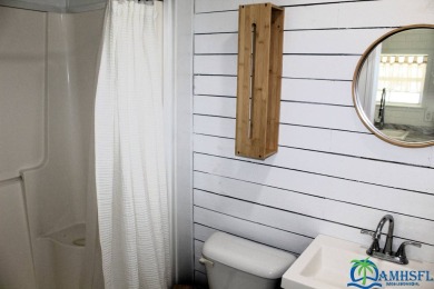 This super fun 1BR/1BA tiny home packs a lot of punch! This home on Lily Lake Golf and RV Resort in Florida - for sale on GolfHomes.com, golf home, golf lot