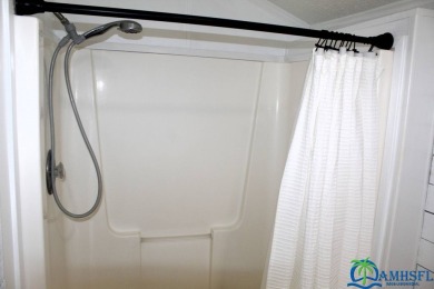 This super fun 1BR/1BA tiny home packs a lot of punch! This home on Lily Lake Golf and RV Resort in Florida - for sale on GolfHomes.com, golf home, golf lot