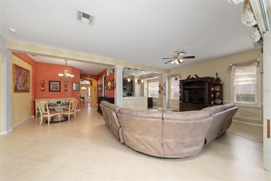 Beautiful 3-bedroom, 2.5-bath home with a large screened-in pool on Hunters Creek Golf Course in Florida - for sale on GolfHomes.com, golf home, golf lot