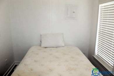 This super fun 1BR/1BA tiny home packs a lot of punch! This home on Lily Lake Golf and RV Resort in Florida - for sale on GolfHomes.com, golf home, golf lot