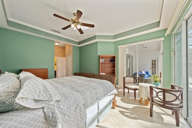 Beautiful 3-bedroom, 2.5-bath home with a large screened-in pool on Hunters Creek Golf Course in Florida - for sale on GolfHomes.com, golf home, golf lot