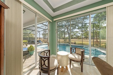 Beautiful 3-bedroom, 2.5-bath home with a large screened-in pool on Hunters Creek Golf Course in Florida - for sale on GolfHomes.com, golf home, golf lot
