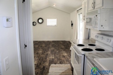 This super fun 1BR/1BA tiny home packs a lot of punch! This home on Lily Lake Golf and RV Resort in Florida - for sale on GolfHomes.com, golf home, golf lot
