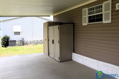 This super fun 1BR/1BA tiny home packs a lot of punch! This home on Lily Lake Golf and RV Resort in Florida - for sale on GolfHomes.com, golf home, golf lot