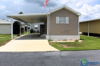 This super fun 1BR/1BA tiny home packs a lot of punch! This home on Lily Lake Golf and RV Resort in Florida - for sale on GolfHomes.com, golf home, golf lot