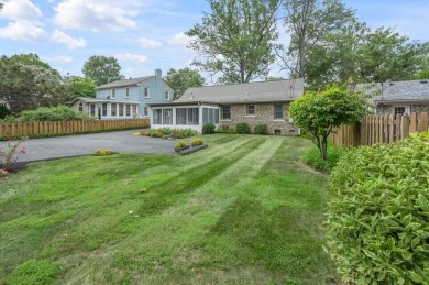This cape cod style stone beauty in Fairway subdivision is for on Idle Hour Country Club in Kentucky - for sale on GolfHomes.com, golf home, golf lot