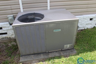 This super fun 1BR/1BA tiny home packs a lot of punch! This home on Lily Lake Golf and RV Resort in Florida - for sale on GolfHomes.com, golf home, golf lot