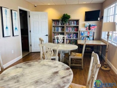 This super fun 1BR/1BA tiny home packs a lot of punch! This home on Lily Lake Golf and RV Resort in Florida - for sale on GolfHomes.com, golf home, golf lot