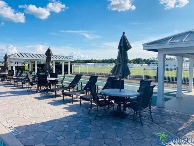 This super fun 1BR/1BA tiny home packs a lot of punch! This home on Lily Lake Golf and RV Resort in Florida - for sale on GolfHomes.com, golf home, golf lot