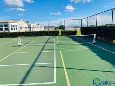 This super fun 1BR/1BA tiny home packs a lot of punch! This home on Lily Lake Golf and RV Resort in Florida - for sale on GolfHomes.com, golf home, golf lot