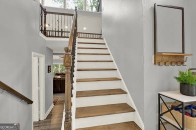 Welcome to 117 Lakeview Circle-an exceptional lakefront retreat on The Highlands Course at Lake Arrowhead in Georgia - for sale on GolfHomes.com, golf home, golf lot