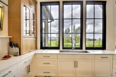 This Modern Masterpiece transcends ordinary luxury with sleek on Teton Springs Resort and Club in Idaho - for sale on GolfHomes.com, golf home, golf lot