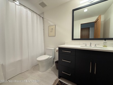 This Modern Masterpiece transcends ordinary luxury with sleek on Teton Springs Resort and Club in Idaho - for sale on GolfHomes.com, golf home, golf lot