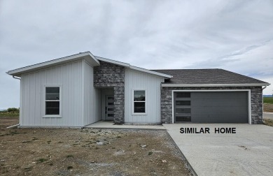 Brand new construction, fully landscaped. Located in Hidden on Hidden Bridge Golf Club in Wyoming - for sale on GolfHomes.com, golf home, golf lot