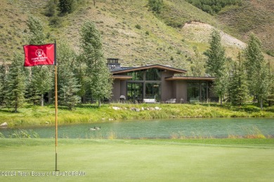 This stunning mountain modern home is situated on one of the on Snake River Sporting Club in Wyoming - for sale on GolfHomes.com, golf home, golf lot