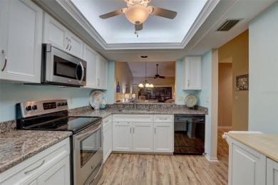 Well maintained END UNIT with WATER VIEW, spacious HIGH CEILINGS on The Meadows Golf and Country Club in Florida - for sale on GolfHomes.com, golf home, golf lot