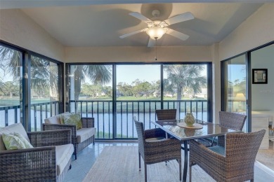 Well maintained END UNIT with WATER VIEW, spacious HIGH CEILINGS on The Meadows Golf and Country Club in Florida - for sale on GolfHomes.com, golf home, golf lot