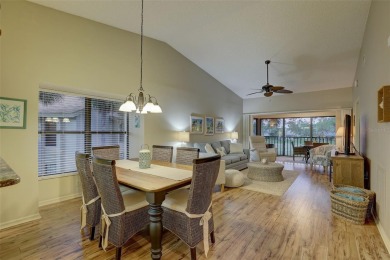 Well maintained END UNIT with WATER VIEW, spacious HIGH CEILINGS on The Meadows Golf and Country Club in Florida - for sale on GolfHomes.com, golf home, golf lot