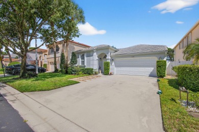 Rarely available single-story courtyard home perfectly situated on  in Florida - for sale on GolfHomes.com, golf home, golf lot