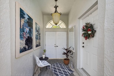 Rarely available single-story courtyard home perfectly situated on  in Florida - for sale on GolfHomes.com, golf home, golf lot