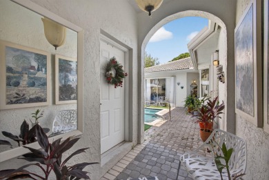 Rarely available single-story courtyard home perfectly situated on  in Florida - for sale on GolfHomes.com, golf home, golf lot